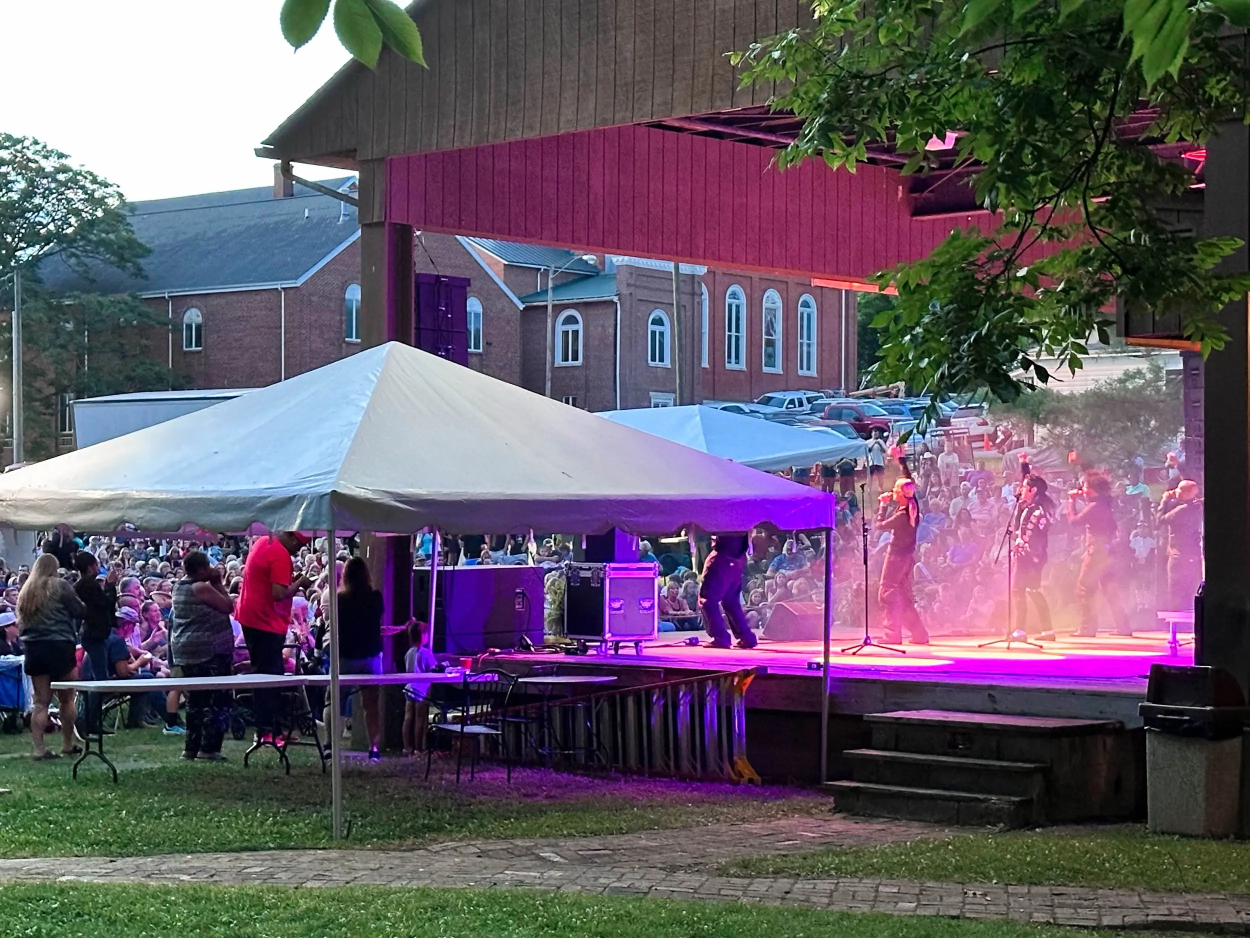 Crowd gathered at an outdoor stage under purple lights during Chautauqua Festival in Wytheville