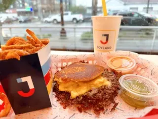 Photo of a crustburger and curly fries